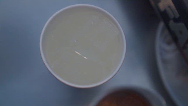 Pouring Espresso into Cup with Ice