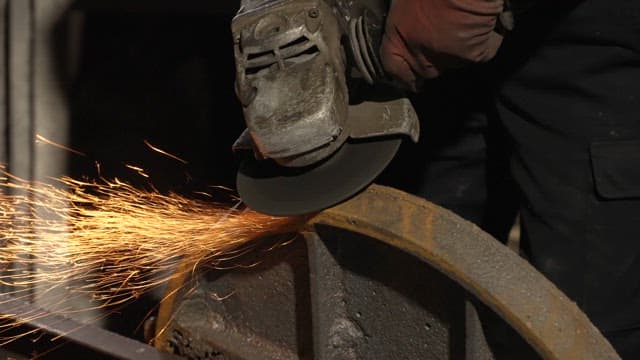 Sparks flying from a grinder on metal