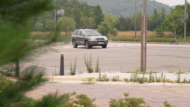 two cars colliding at an intersection