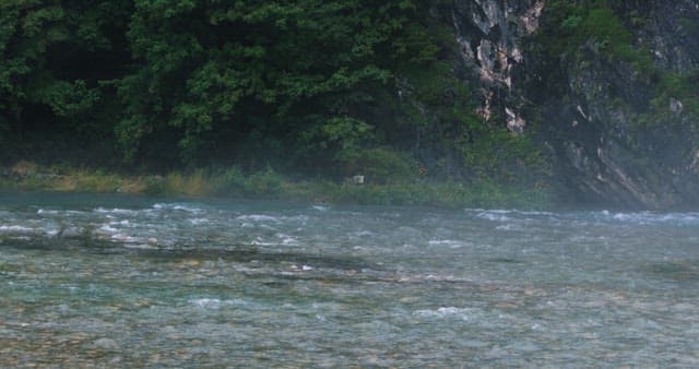 Misty River Flowing Through a Rocky Gorge