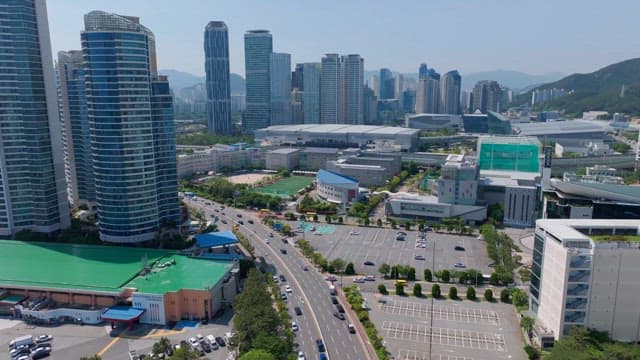 Cityscape with modern buildings and busy roads on a sunny day