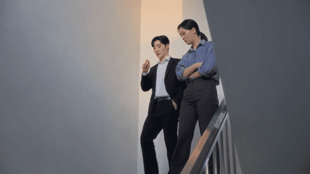 Two colleagues discussing on a staircase