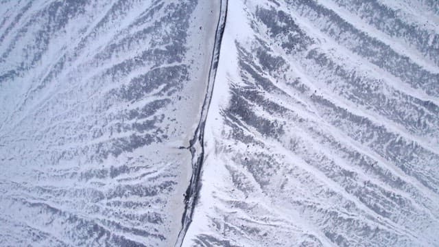 Snow-covered volcanic crater in winter