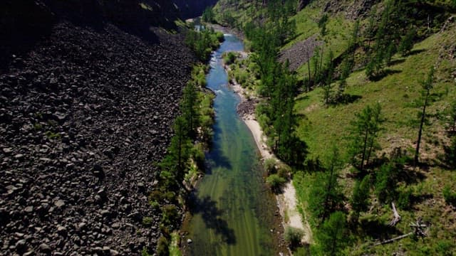 Serene River Flowing Through a Rocky Canyon
