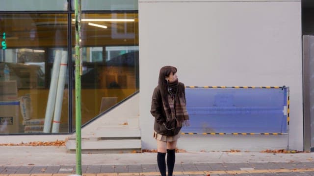 Student waiting at a bus stop