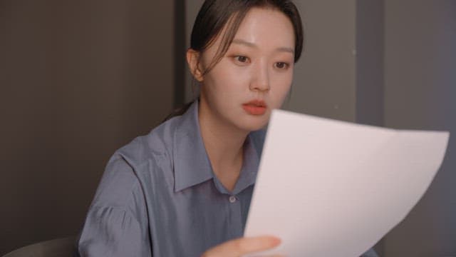 Woman focused on reading a document