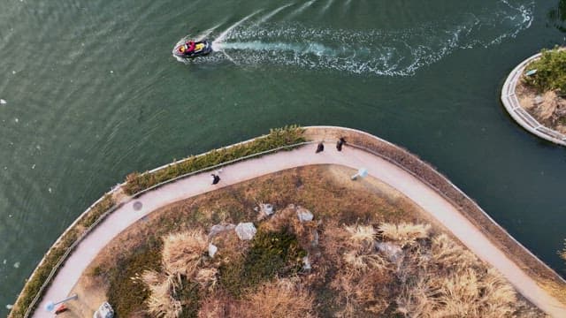 Speedboat Circling Along the Park Trail