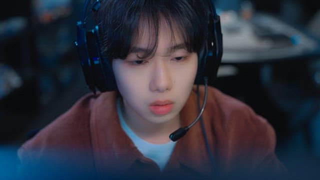 Person Deep in Thought While Looking at a Screen in a PC room