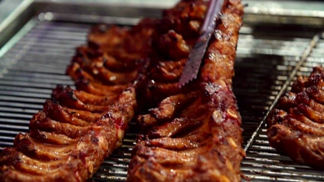 Sizzling grilled pork galbi on the grill