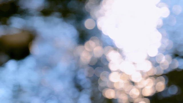 light reflecting on a flowing river