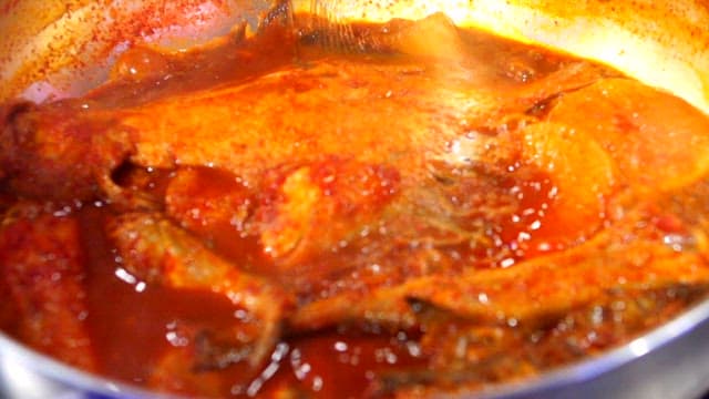 Steamed fish containing various fish simmering in a pot