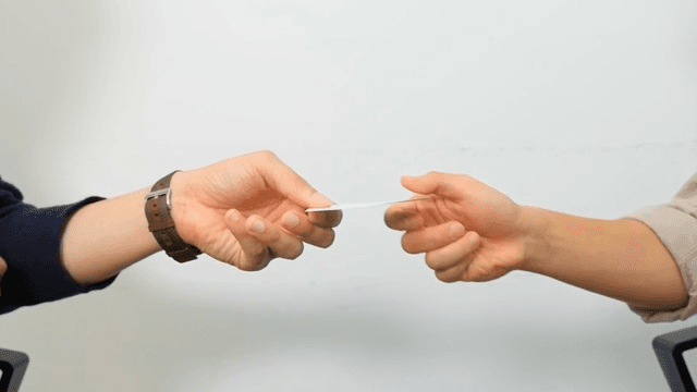 People Exchanging Business Cards with Each Other