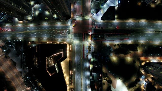 Night View Illuminated by the Lights of Buildings and Traffic in a Bustling City