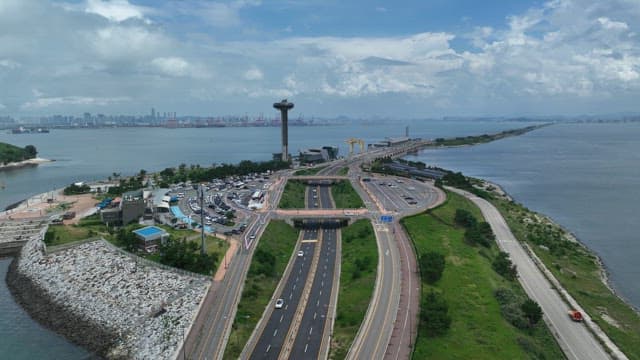 Coastal Highway and High-rise Observation Tower on a Cloudy Day