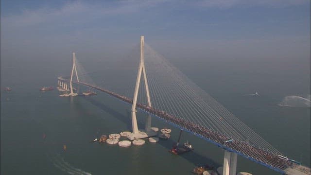 Incheon Bridge with marathon runners running