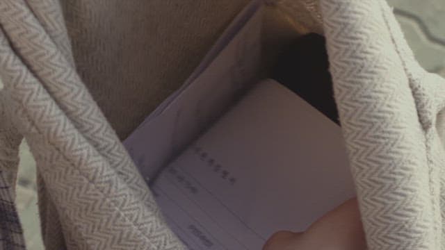 Person searching for something inside a bag