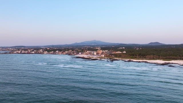 Coastal town with distant mountains