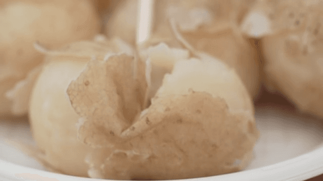 Peeling Boiled Potatoes on a Plate
