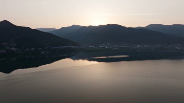 Sunrise over a tranquil mountain lake