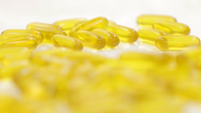 Yellow Gel Capsule Pills Containing Omega 3