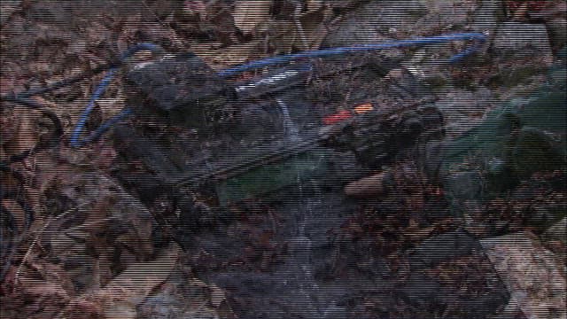 Person operating recording equipment outdoors