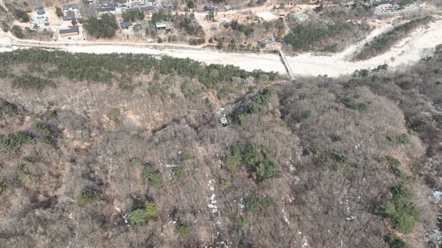 Cable Car Over Forested Valley
