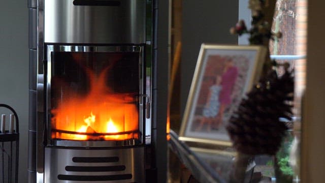 Cozy fireplace in a warmly decorated living room