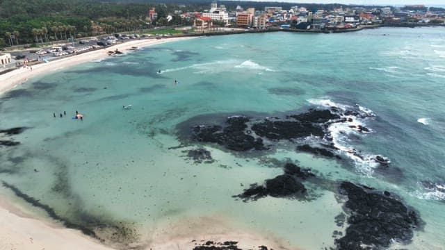 Scenic beach with clear waters and rocks