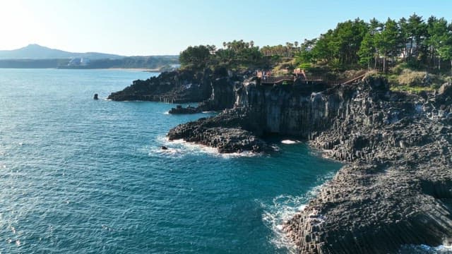 Coastal cliffs and blue ocean waves