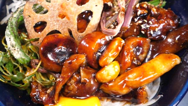 Appetizing tripe rice bowl with various ingredients