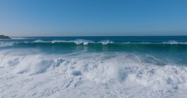 Waves Rolling Beneath the Blue Horizon