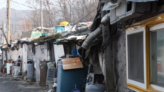Dilapidated Alleyway with Houses