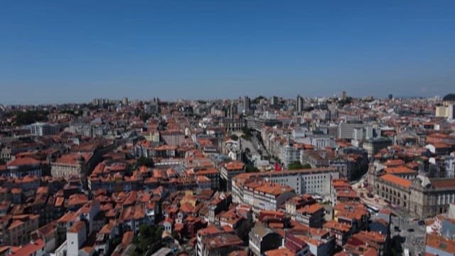 Historic Cityscape with Red Rooftops on a Sunny Day