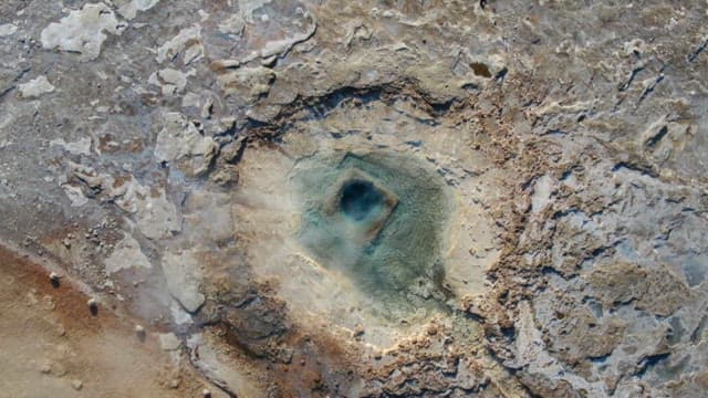 Geyser Eruption in Geothermal Field on a Sunny Day