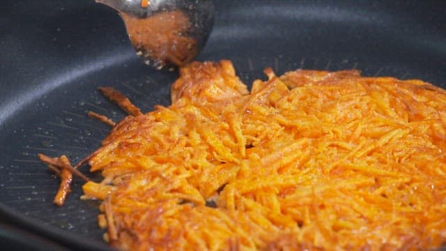 Carrot Pancakes Cooked on an Oiled Frying Pan
