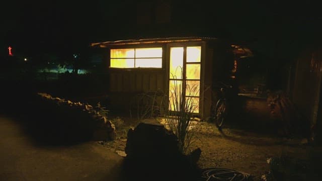 Small illuminated building at night