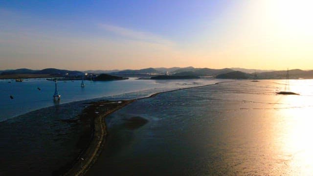 Serene coastal landscape under early morning sunlight