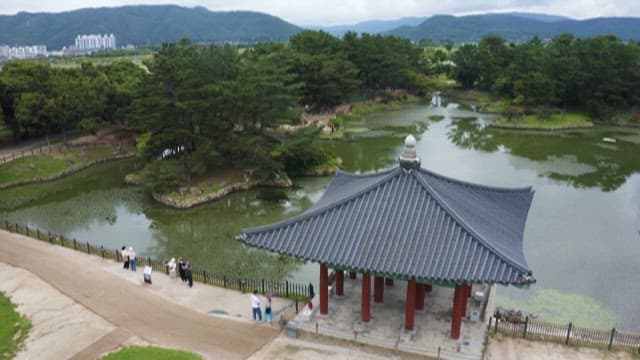 Tranquil Traditional Korean Garden and Pond with Some Tourtists