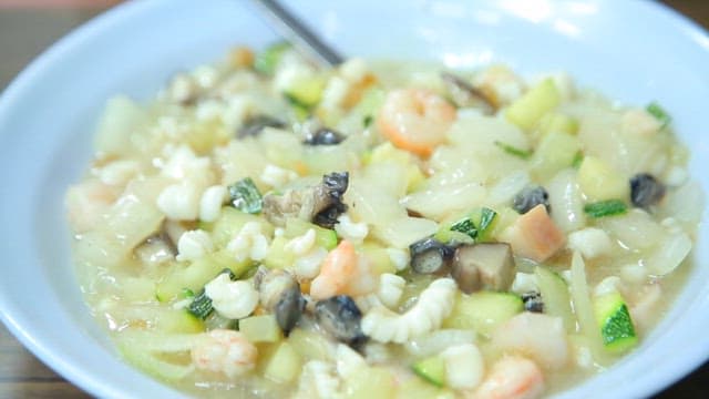 Bowl of thick jjajang with mixed seafood and vegetables