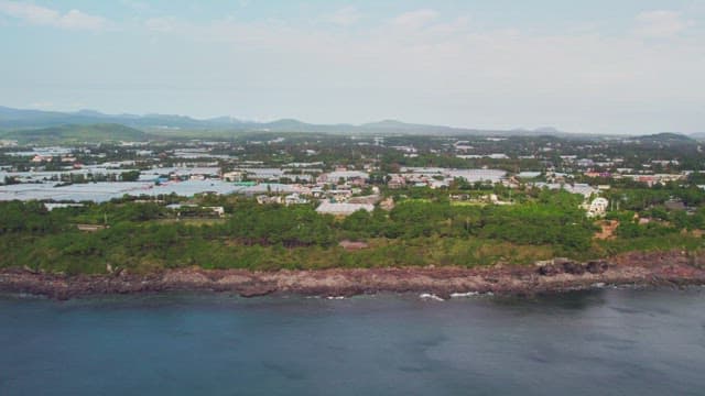 Coastal town with distant mountains