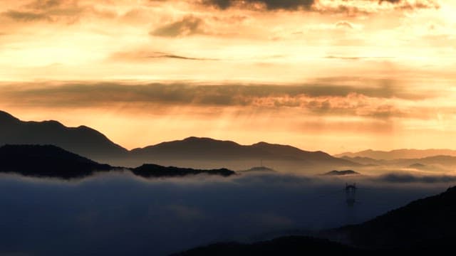 Mountains with mist and sunrise