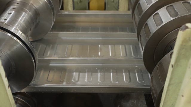Metal sheet being processed in a factory