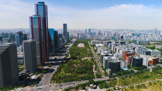 Green Park Between Dense Buildings