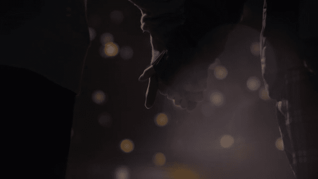 Couple holding hands in the dark night, dim lights