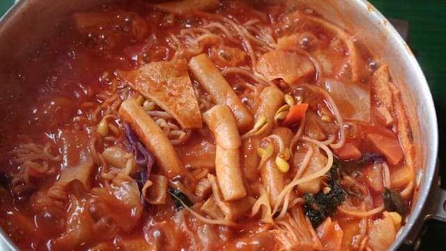 Close-up of Tteokbokki with Ramen in a Pot