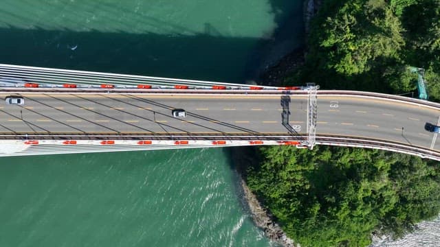 Cars driving on a bridge over water