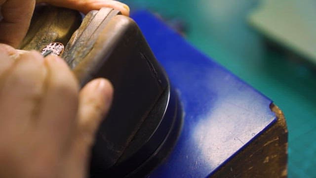 Craftsman Carving Wood in Workshop
