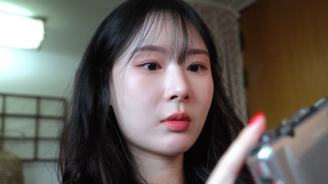 Woman operating a cassette player