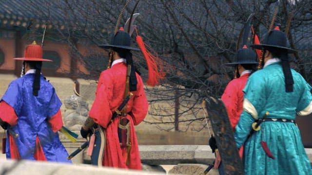 Royal guards marching in traditional Korean hanbok