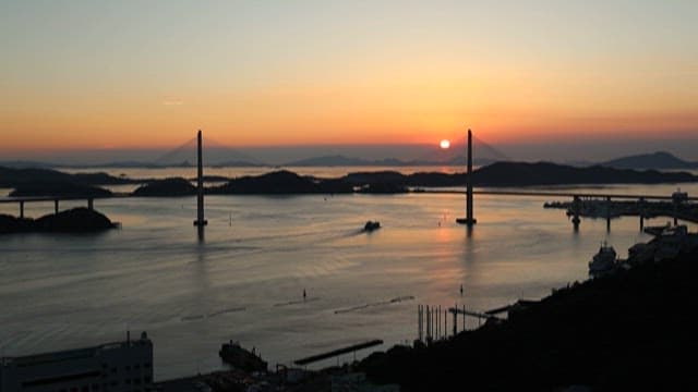 Serene sunset over bridge and sea